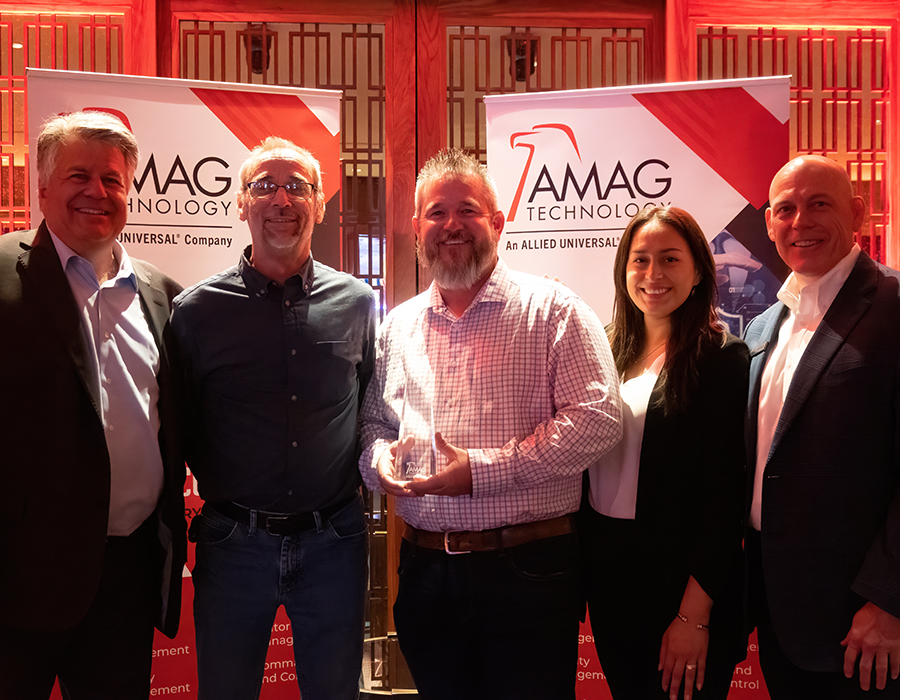 Photo of five people smiling as AMAG Technology Celebrates Top Performing Resellers